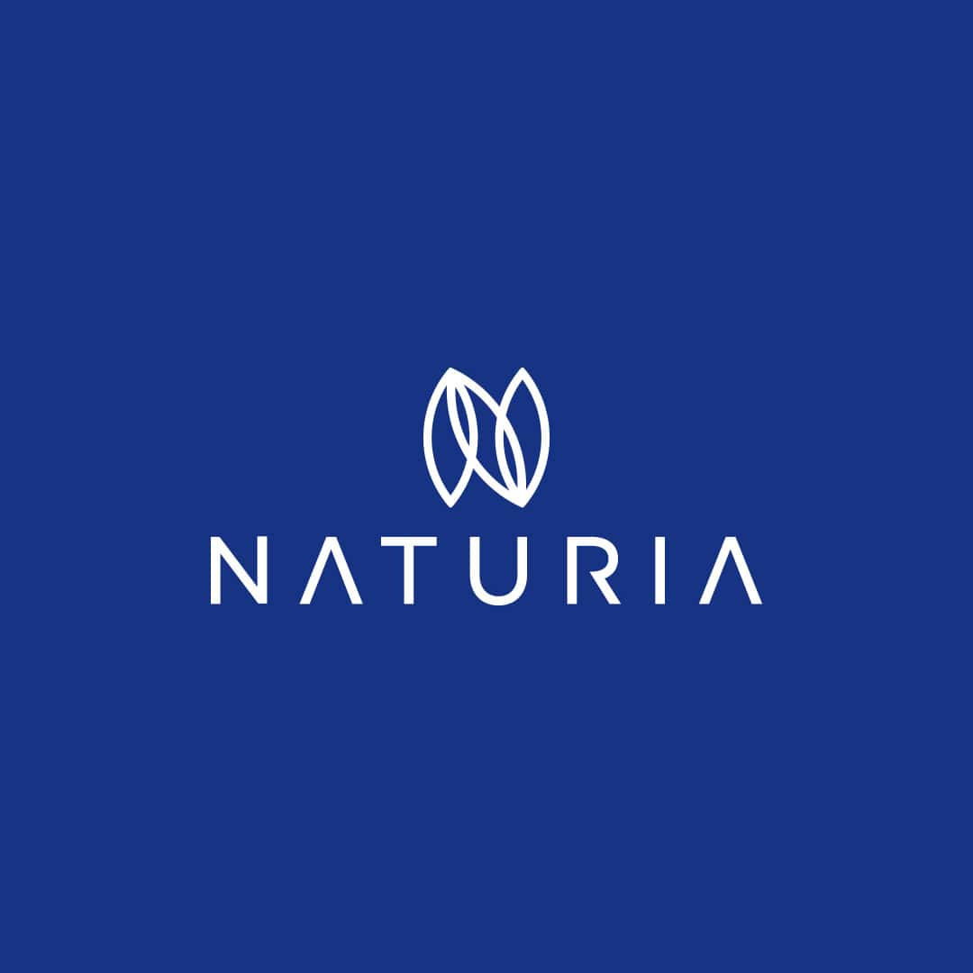 A blue background featuring the Naturia Haircare Products logo, elegantly crafted from three leaf-shaped elements arranged to form the letter "N."